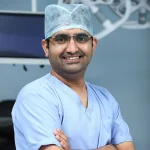 Dr Mohan Venkatesh Pulle in surgical scrubs
